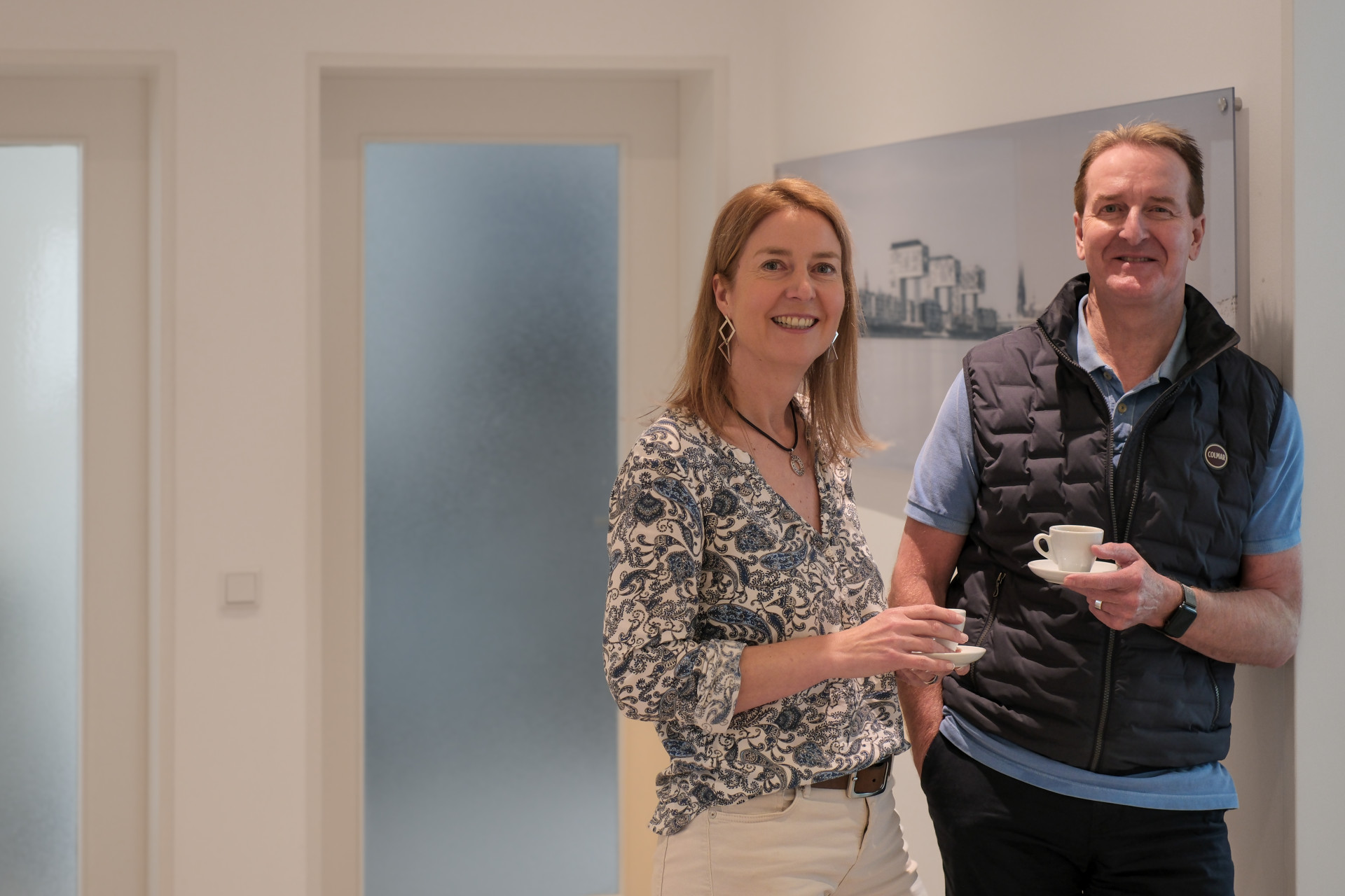 Two people enjoying coffee together, suggesting a relaxed and friendly atmosphere. Two people enjoying coffee together, suggesting a relaxed and friendly atmosphere.